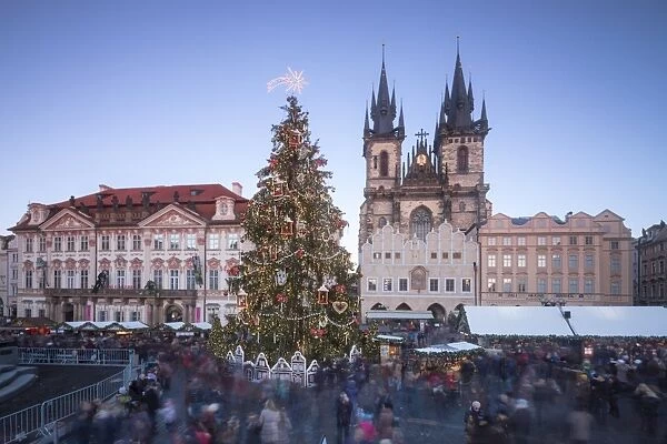 Tourists at the Christmas markets facing the Cathedral of St. Vitus, Old Town Square