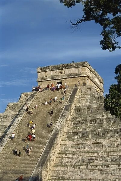 Tourists climbing El Castillo