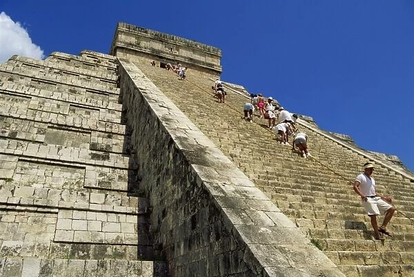 Tourists climbing El Castillo, Chichen Itza, UNESCO World Heritage Site