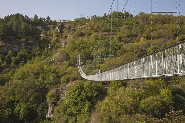 Tourists crossing Swinging Bridge over Khndzoresk Canyon, Khndzoresk, Goris, Armenia, Central Asia, Asia
