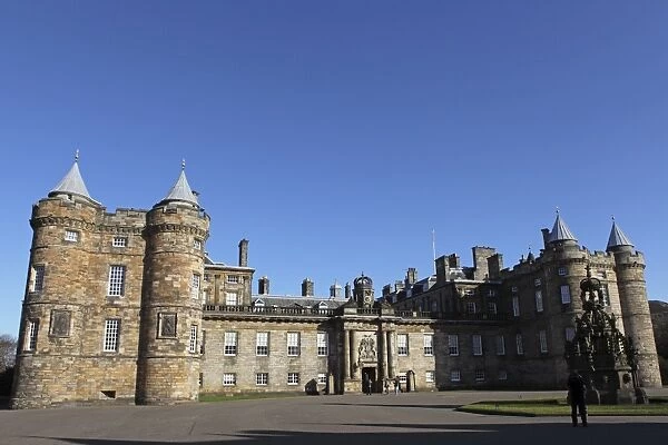 Tourists enter the Palace of Holyroodhouse, the official royal residence of the Queen in Edinburgh