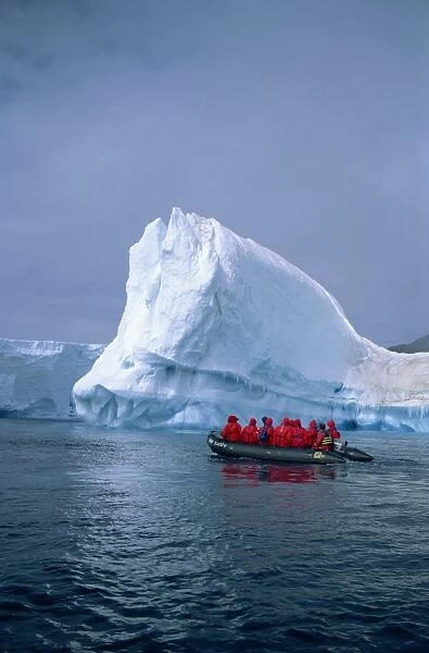 Tourists exploring icebergs by dinghy, Antarctica, Polar Regions