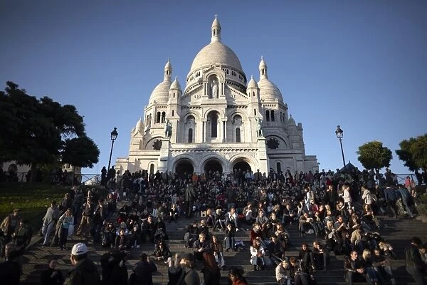Tourists gather at the Sacre Coeur, Montmartre, Paris, France, Europe