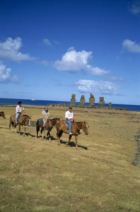 Framed Print : Tourists on horseback touring sites of moai or statues, at Ahu Vai Uri on Easter Island