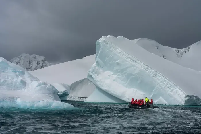 Framed Print : Tourists in an inflatable boat exploring Pleneau Island, Antarctica, Polar Regions Framed Print : Tourists in an inflatable boat exploring Pleneau Island, Antarctica, Polar Regions