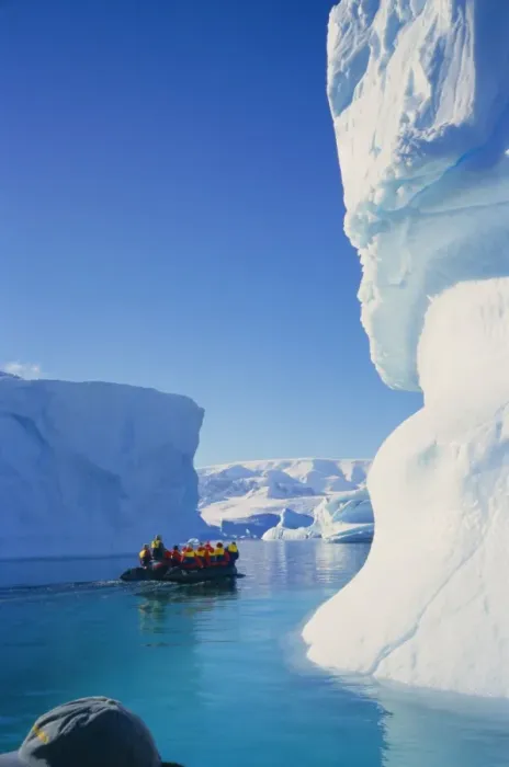 Framed Print : Tourists in inflatable cruising past icebergs, Antarctica Framed Print : Tourists in inflatable cruising past icebergs, Antarctica