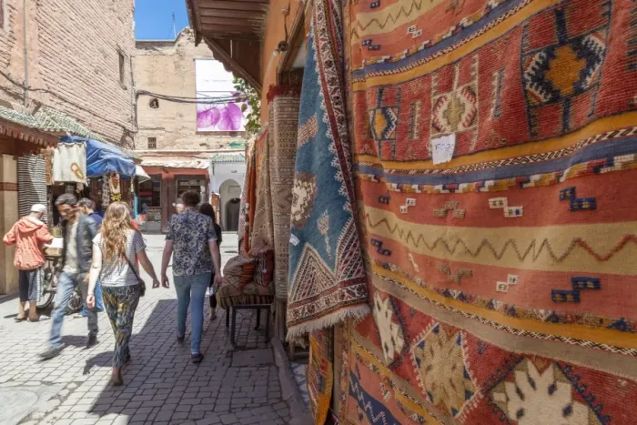 Framed Print : Tourists and locals walking alongside traditional rugs in the Medinas souks, Marrakech, Morocco, North Africa, Africa Framed Print : Tourists and locals walking alongside traditional rugs in the Medinas souks, Marrakech, Morocco, North Africa, Africa