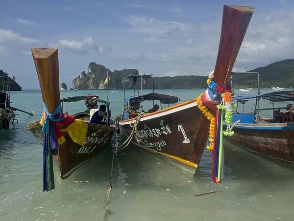 Tourists on long-tail boat in the Phi Phi islands, Andaman Sea, Thailand, Southeast Asia