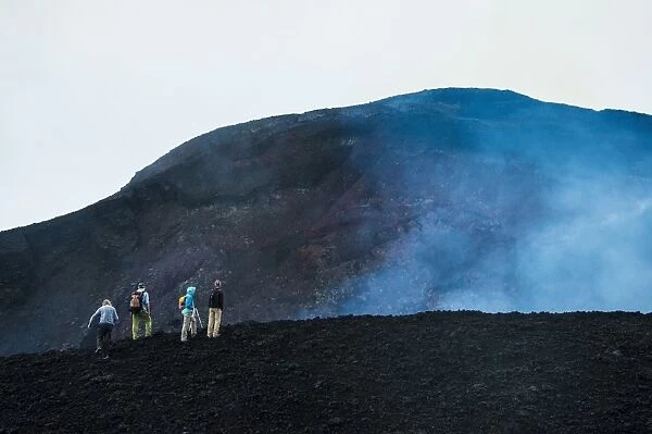 Tourists looking at an active lava eruption on the Tolbachik volcano, Kamchatka, Russia, Eurasia