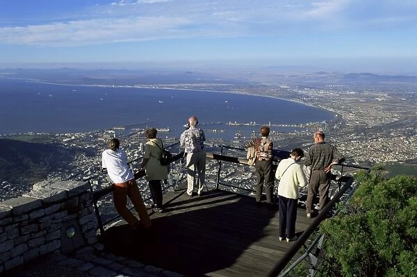 Tourists looking down at Cape Town from the top of Table Mountain