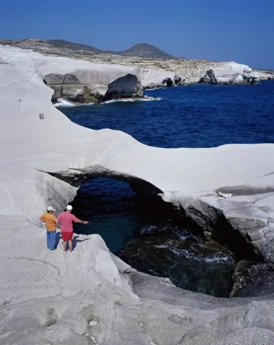 Framed Print : Tourists looking at Sarakiniko volcanic rock formations Framed Print : Tourists looking at Sarakiniko volcanic rock formations