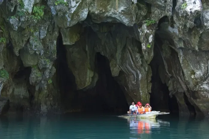 Framed Print : Tourists in paddle boat at entrance to Riverine Cave Framed Print : Tourists in paddle boat at entrance to Riverine Cave