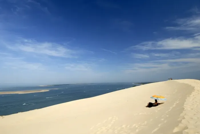 Framed Print : Tourists under a parasol on the Dune du Pyla, largest dune in Europe, Bay of Arcachon Framed Print : Tourists under a parasol on the Dune du Pyla, largest dune in Europe, Bay of Arcachon