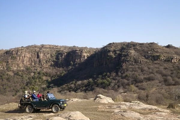 Tourists on safari in open jeep, Ranthambore National Park, Rajasthan, India, Asia