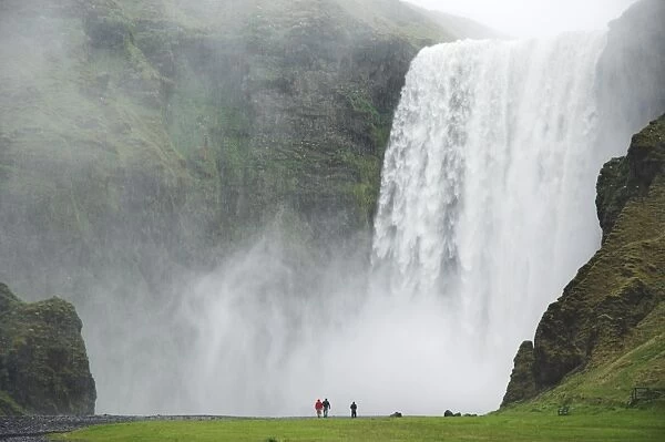 Tourists at Skogafoss waterfall