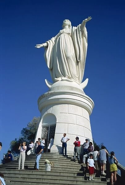 Tourists below a statue of the Virgin Mary, Cerro San Cristobal, Santiago