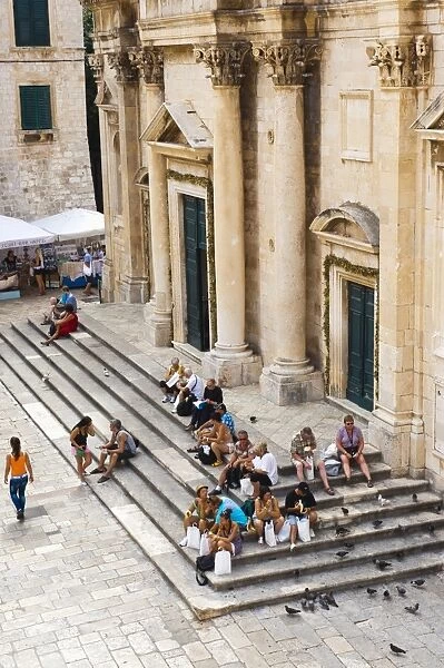 Tourists on the steps of Dubrovnik Cathedral (Cathedral of the Assumption of the Virgin Mary), Dubrovnik, Croatia, Europe