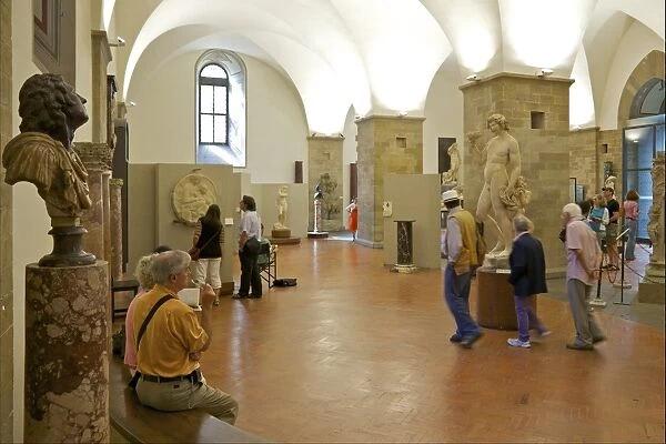 Tourists and visitors in the Michelangelo Room, Bargello, Florence, Tuscany
