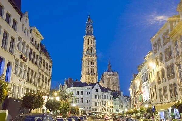 Tower of Onze Lieve Vrouwekathedraal and street illuminated at night, Antwerp
