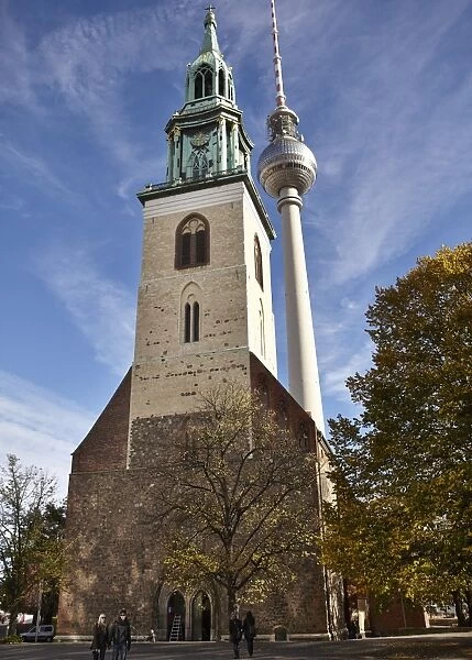Tower of St. Marys church set against Berlins TV Tower, Berlin, Germany, Europe