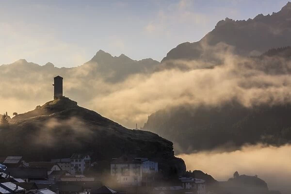Tower of Steinsberg Castle shrouded by mist, Ardez, canton of Graub?nden, district of Inn