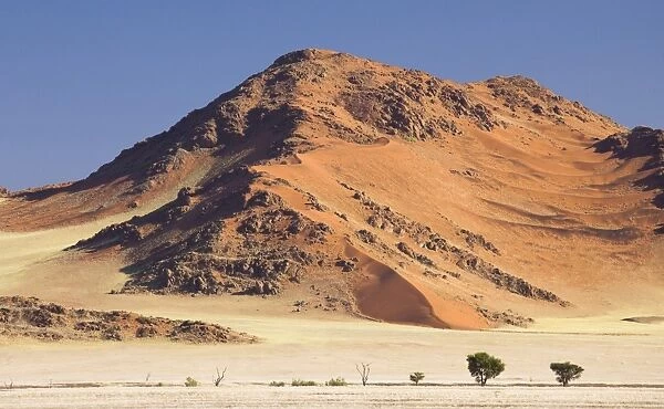 Towering sandstone mountains and dunes in the ancient Namib Desert near Sesriem, Namib Naukluft Park, Namibia, Africa