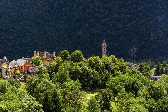 Framed Print : The township of Varzo viewed from a distance wth roof tops and spire above the alpine forest, Varzo, Piemonte (Piedmont), Northern Italy, Europe Framed Print : The township of Varzo viewed from a distance wth roof tops and spire above the alpine forest, Varzo, Piemonte (Piedmont), Northern Italy, Europe