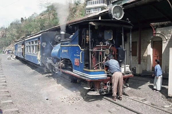 Toy train from Darjeeling to plains refuelling at Goom station