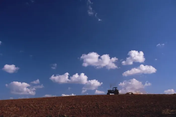Framed Print : Tractor crossing field, Cuba, West Indies, Central America