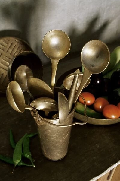 Traditional brass kitchen utensils in a home