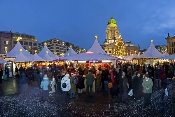 Traditional Christmas Market at Gendarmenmarkt illuminated at dusk, Berlin
