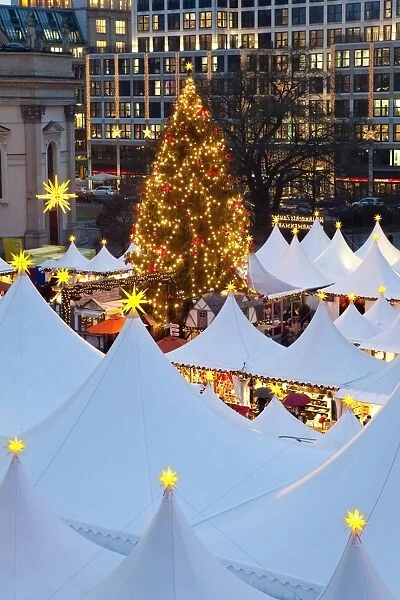 Traditional Christmas Market at Gendarmenmarkt, illuminated at dusk, Berlin