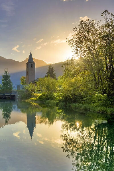 Traditional church of Sils facing Inn River at sunrise, Sils Maria, Engadine valley