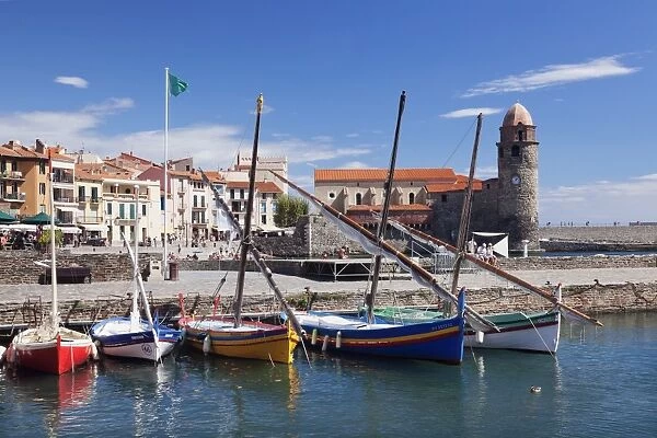 Traditional fishing boats at the port, fortress church Notre Dame des Anges, Collioure