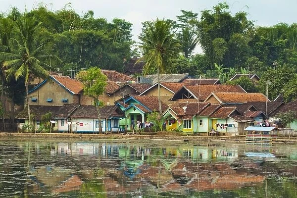 Traditional homes and Situ Cangkuang lake at this village known for its Hindu temple, Kampung Pulo, Garut, West Java, Indonesia, Southeast Asia, Asia