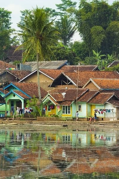 Traditional homes and Situ Cangkuang lake at this village known for its Hindu temple, Kampung Pulo, Garut, West Java, Indonesia, Southeast Asia, Asia