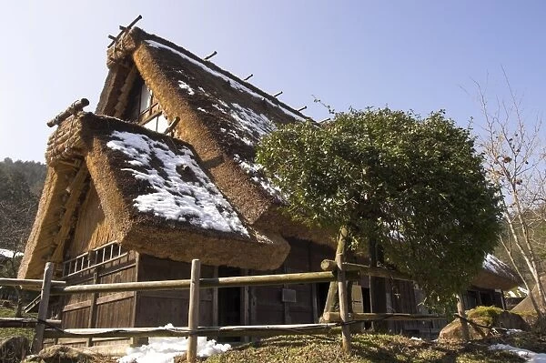 Traditional house with thick thatch roof