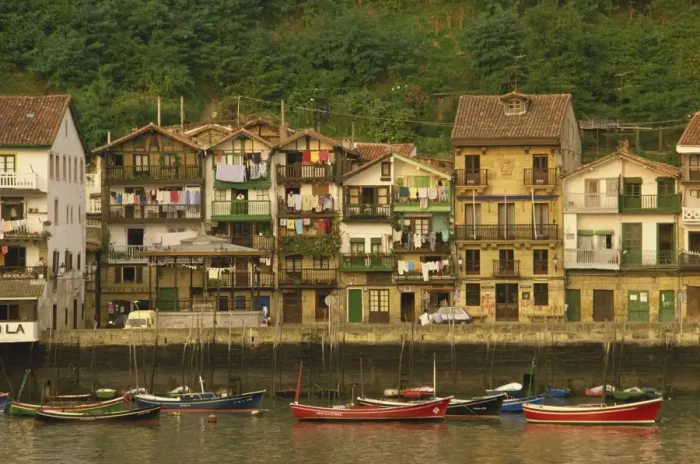 Framed Print : Traditional houses along the waterfront and small boats Framed Print : Traditional houses along the waterfront and small boats