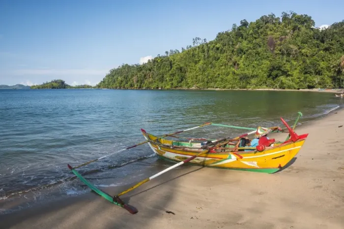 Framed Print : Traditional Indonesian fishing boat on the beach at Sungai Pinang Fishing Village