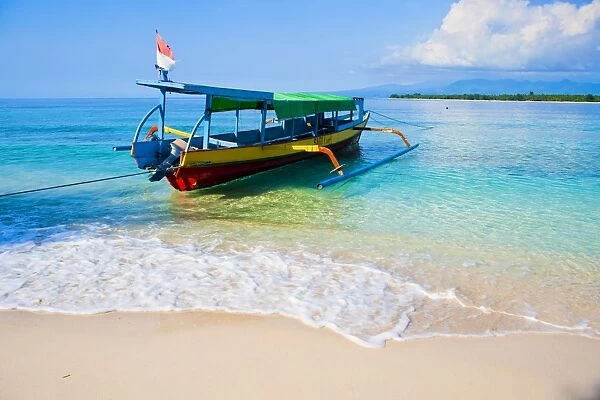 Traditional Indonesian outrigger fishing boat on the island of Gili Meno in the Gili Isles, Indonesia, Southeast Asia, Asia