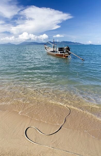 Traditional long-tailed fishing boat moored off Maenam Beach on the North Coast of Koh Samui, Thailand, Southeast Asia, Asia