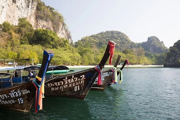 Traditional longtail boats and limestone cliffs, Hong Island, one of the Koh Hong Islands