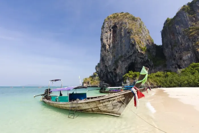 Framed Print : Traditional Longtail boats moored by Phra Nanag Beach with limestone cliffs in the background Framed Print : Traditional Longtail boats moored by Phra Nanag Beach with limestone cliffs in the background