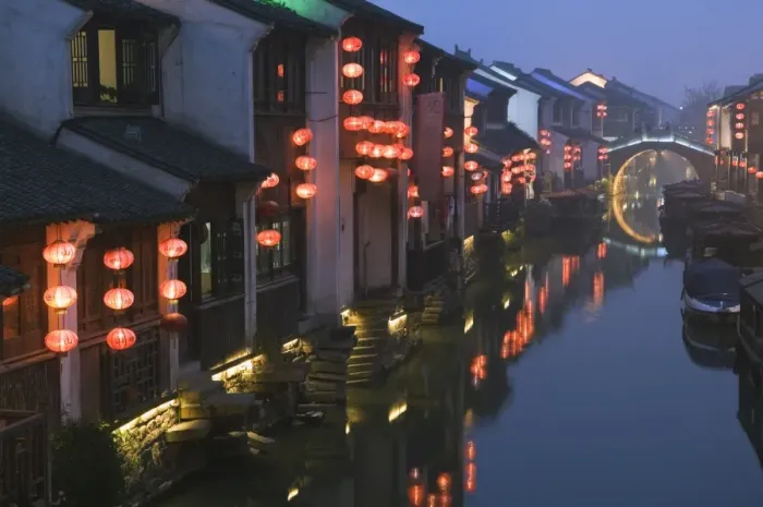Framed Print : Traditional old riverside houses illuminated at night in Shantang water town Framed Print : Traditional old riverside houses illuminated at night in Shantang water town