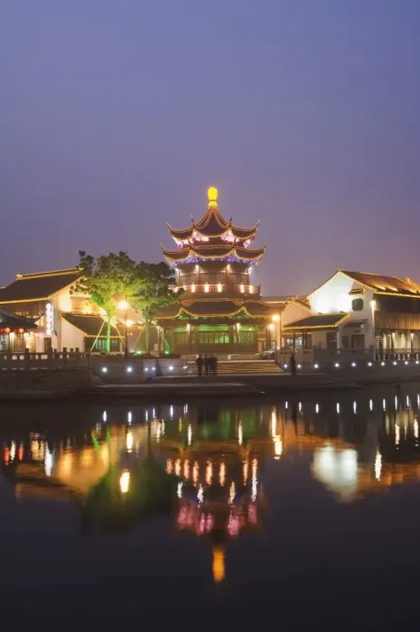 Framed Print : Traditional old riverside houses and pagoda illuminated at night in Shantang water town Framed Print : Traditional old riverside houses and pagoda illuminated at night in Shantang water town