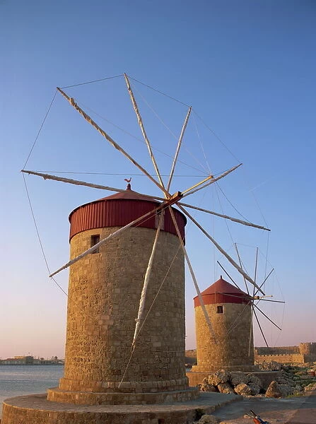 Traditional old stone windmills in dusk light