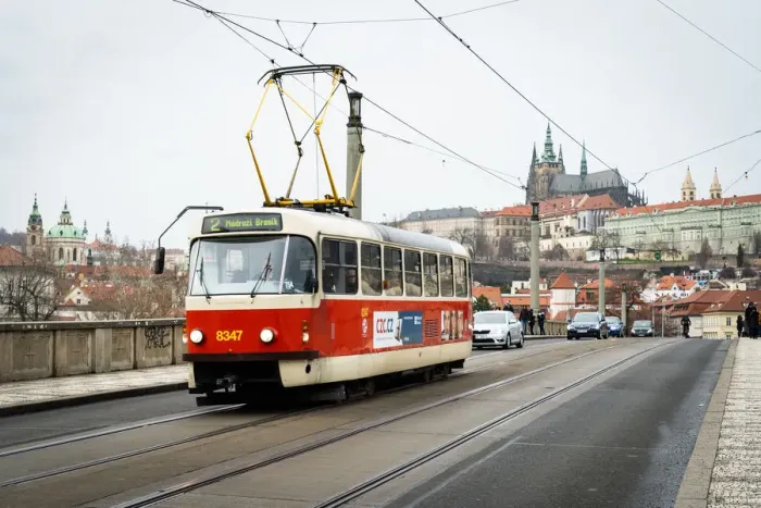 Framed Print : A traditional red tram crosses Manesuv most (bridge) with St Framed Print : A traditional red tram crosses Manesuv most (bridge) with St