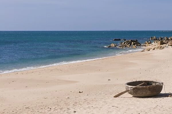 Traditional round boat lying on a beach, Vietnam, Indochina, Southeast Asia, Asia