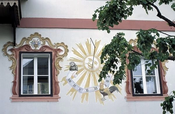 Detail of traditional sun clock (sun dial) on the exterior wall of a building