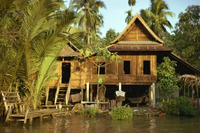 Framed Print : A traditional Thai house on stilts above the river in Bangkok Framed Print : A traditional Thai house on stilts above the river in Bangkok